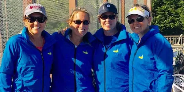 Four campers in blue jackets