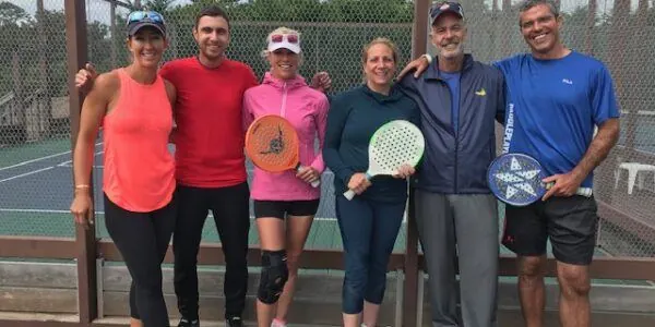 Coaches and campers with paddles