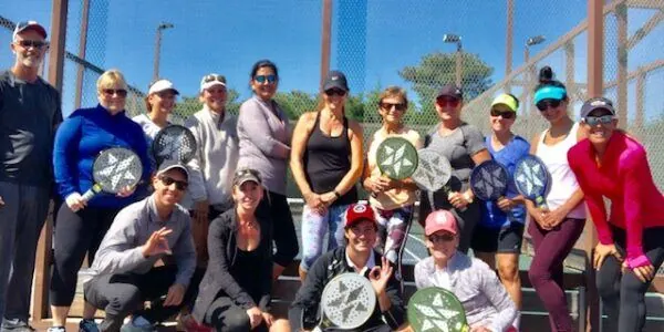 Session group on a sunny day with paddles