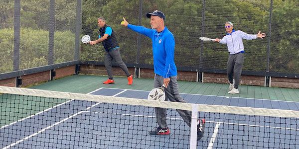 Coaches demonstrating at the net