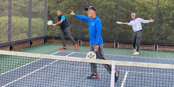 Coaches demonstrating at the net