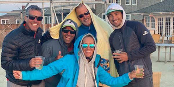 Coaching crew with drinks on a breezy day
