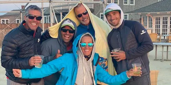 Coaching crew with drinks on a breezy day