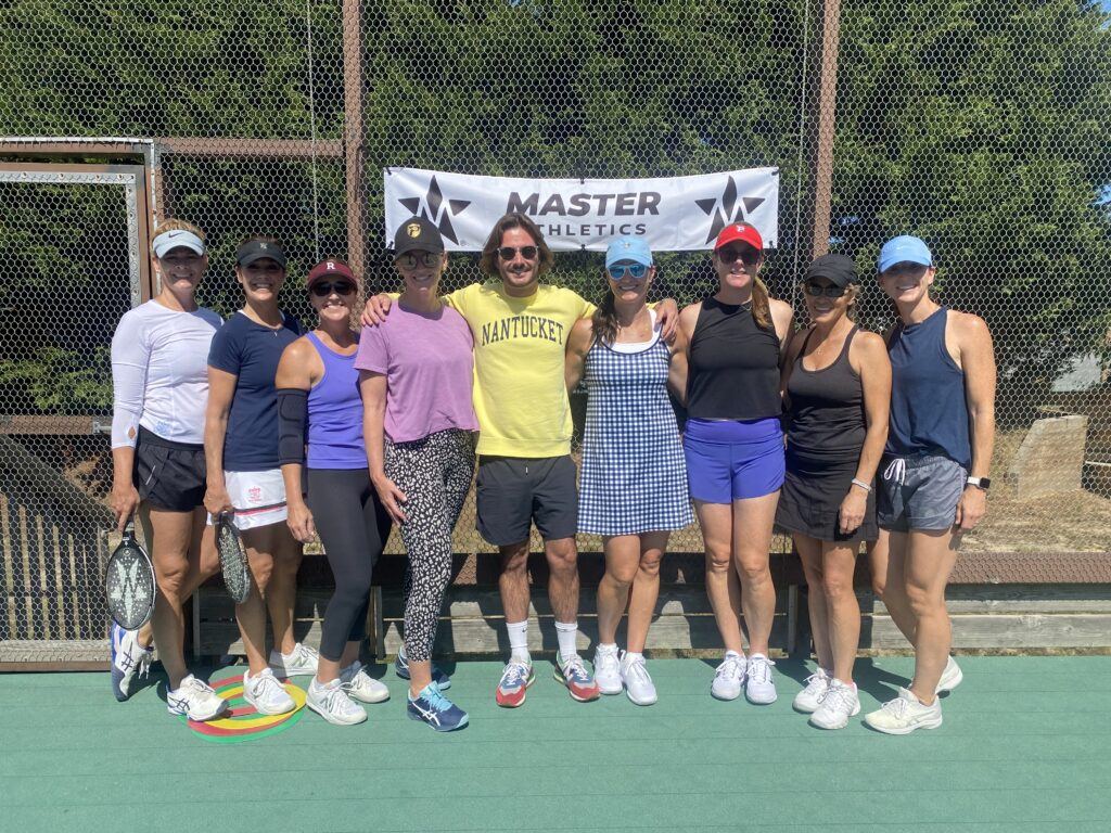 Campers and coaches group photo on court