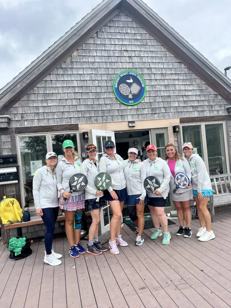Small group on the NRSA deck with paddles