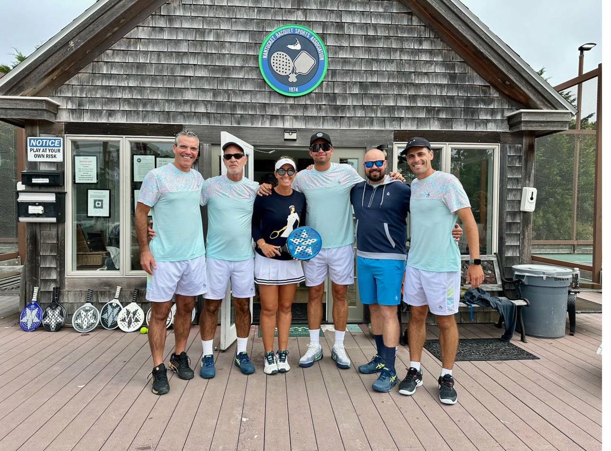 Coaching staff group at NRSA clubhouse entrance