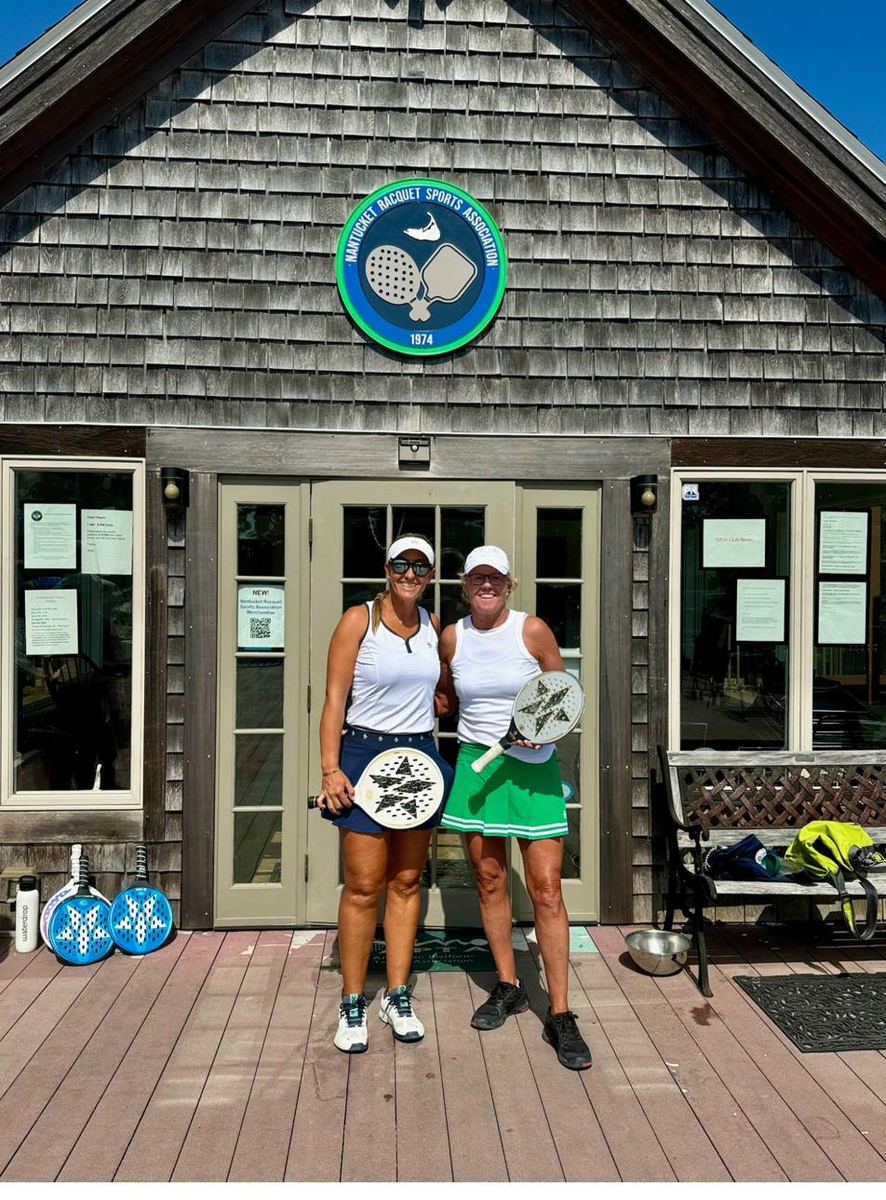 Two women with paddles at NRSA clubhouse