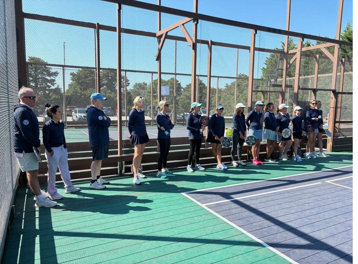 Campers and coaches group on the courts