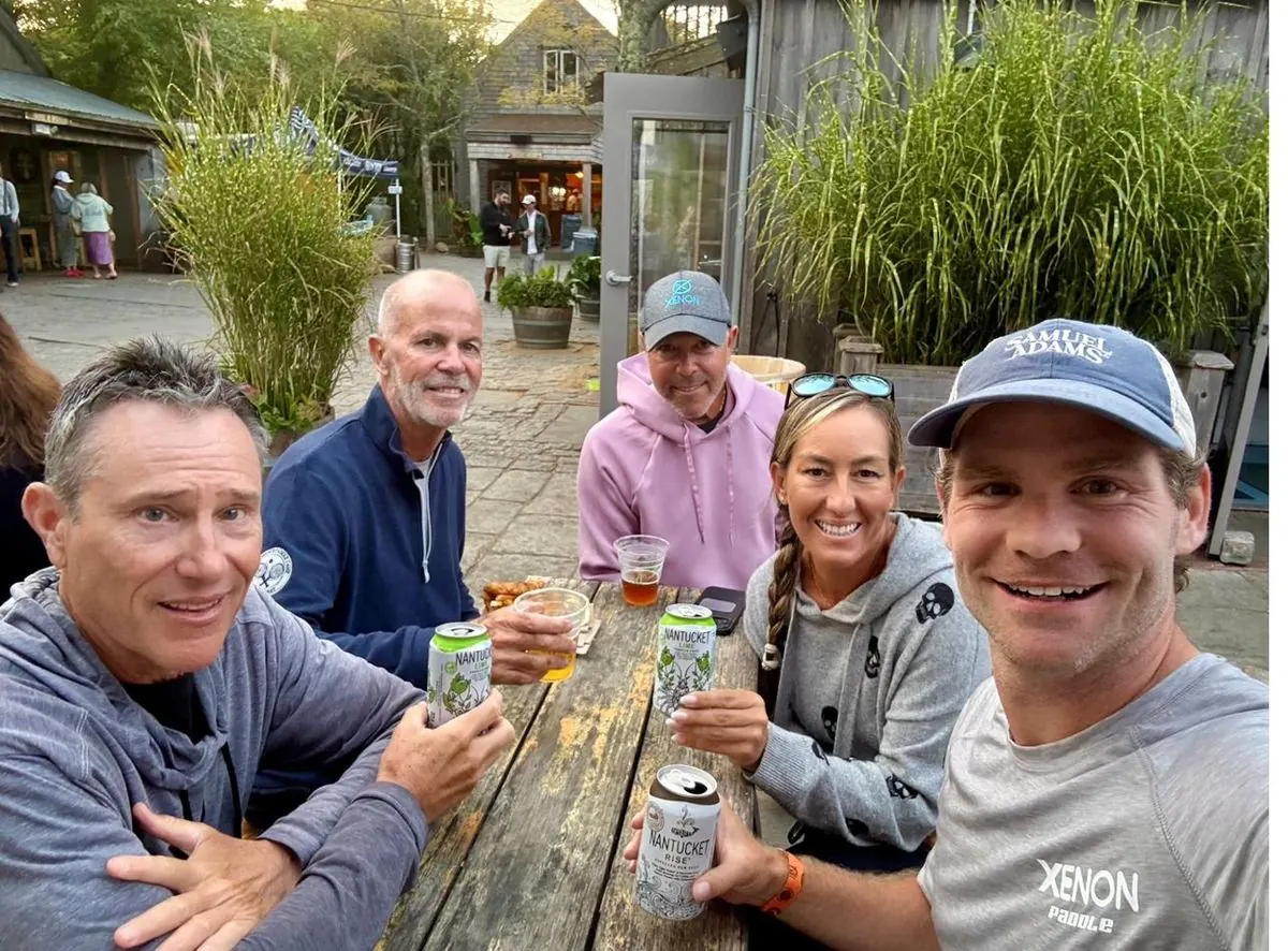 Coaches relaxing with drinks after camp