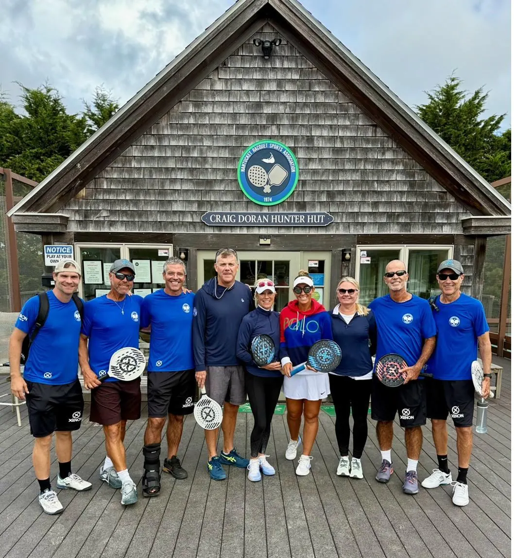 Coaching team at NRSA clubhouse with Xenon paddles