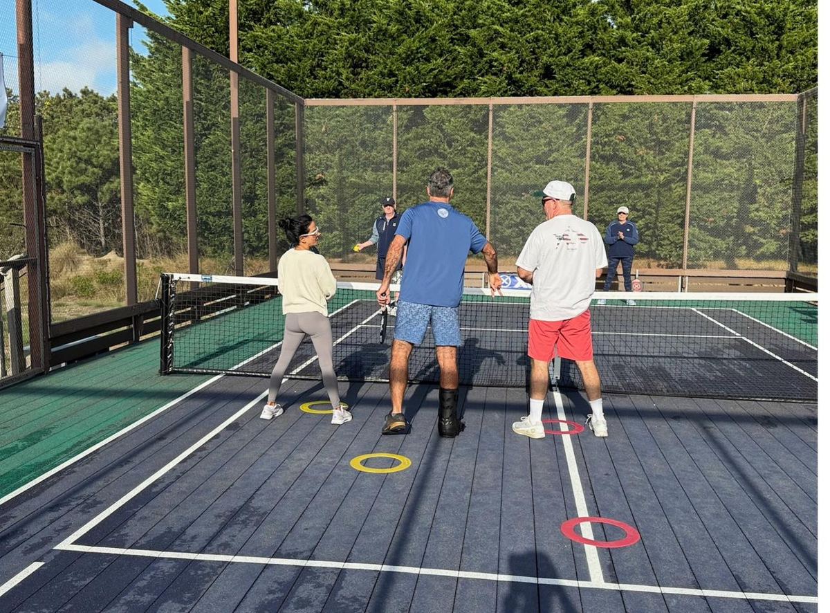 Mixed doubles drill with placement rings on court