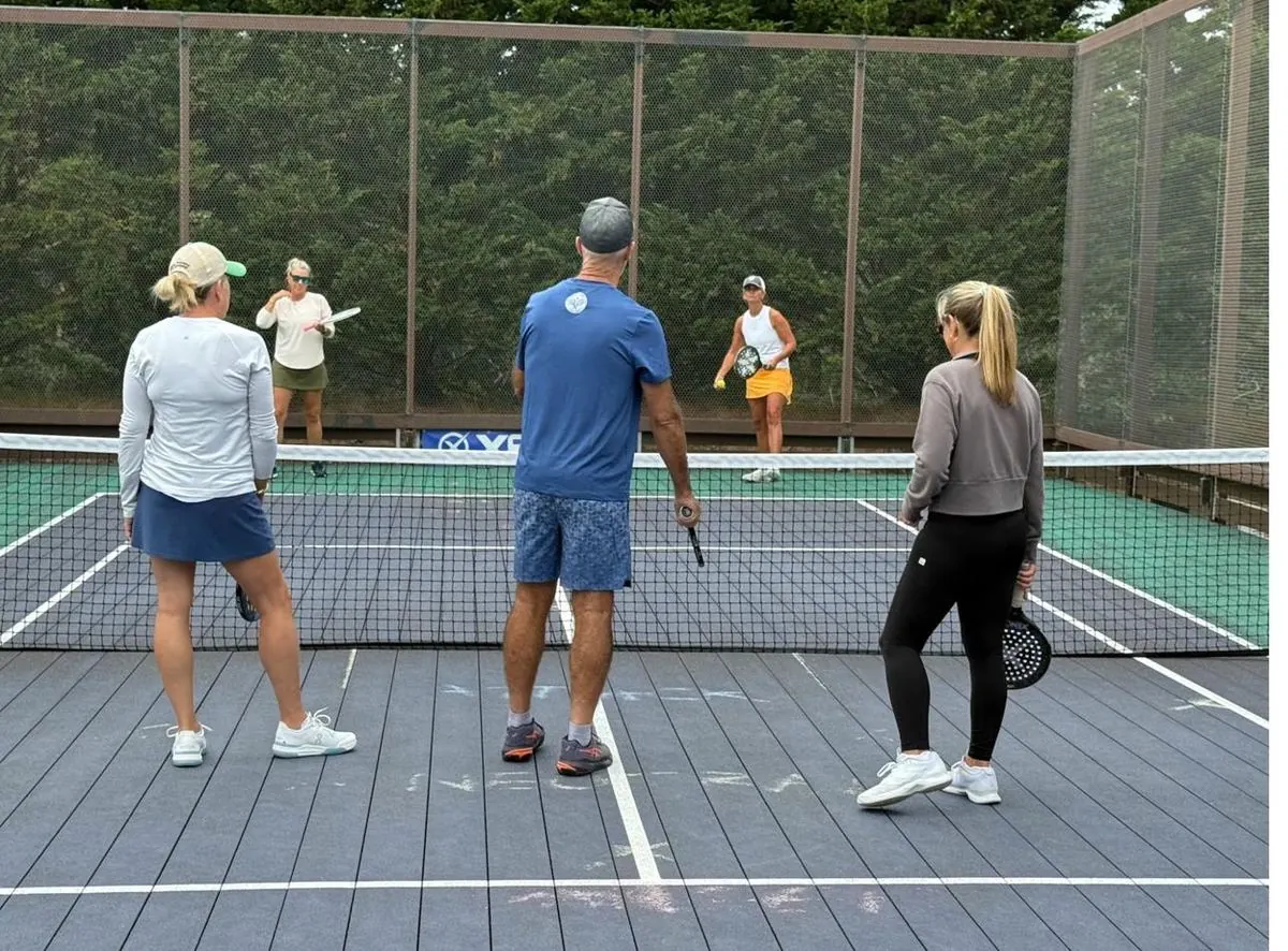 Doubles point in progress on the courts
