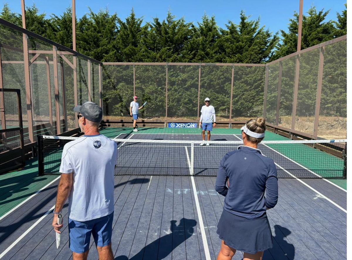 Group photo with paddles raised