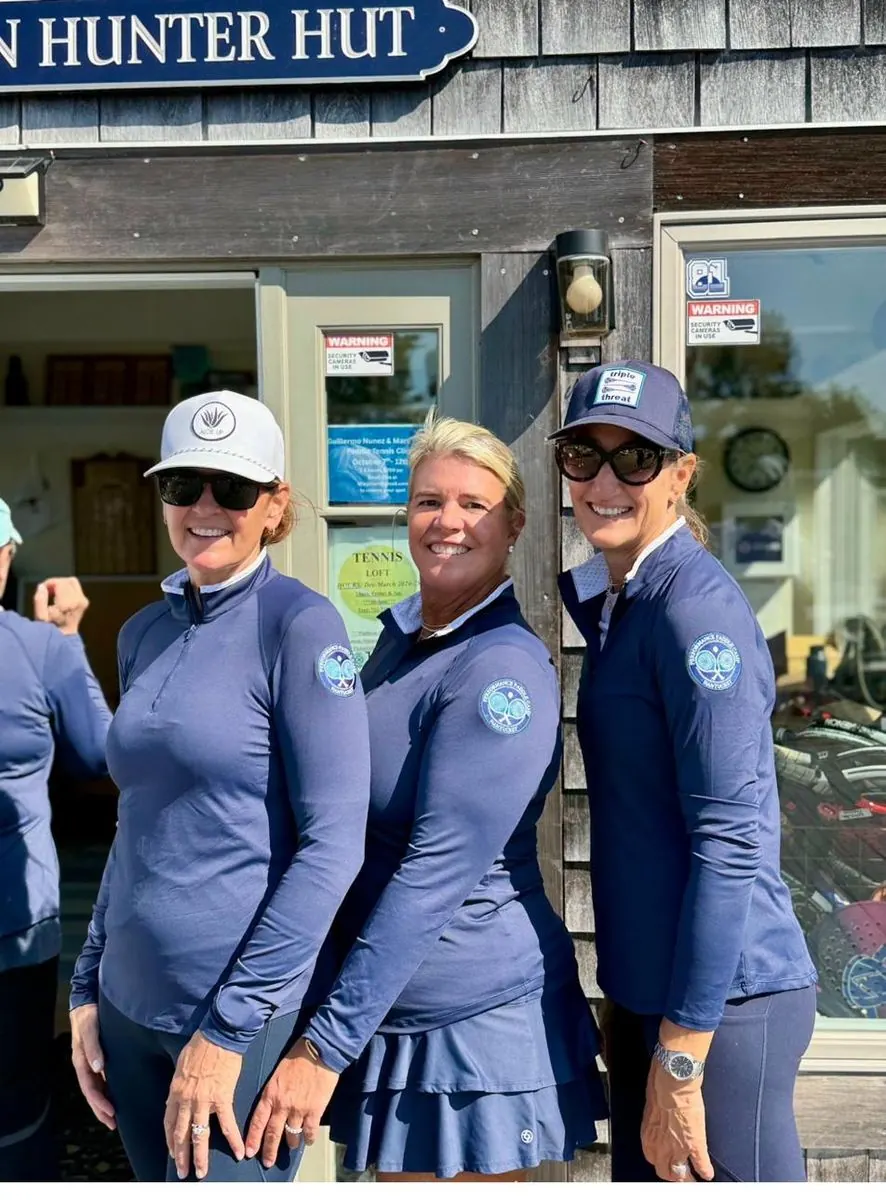 Three campers in camp gear at Hunter Hut