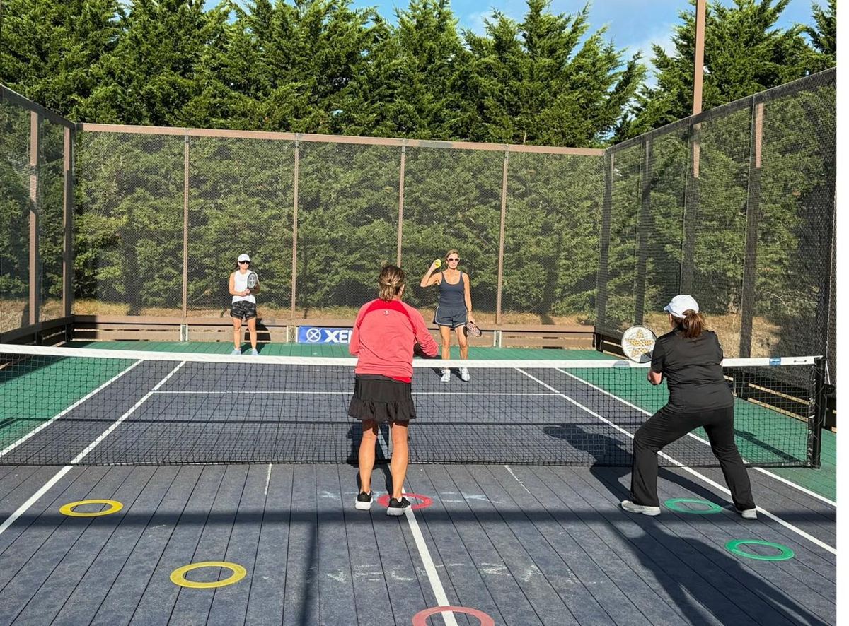 Womens doubles drill with placement rings on court