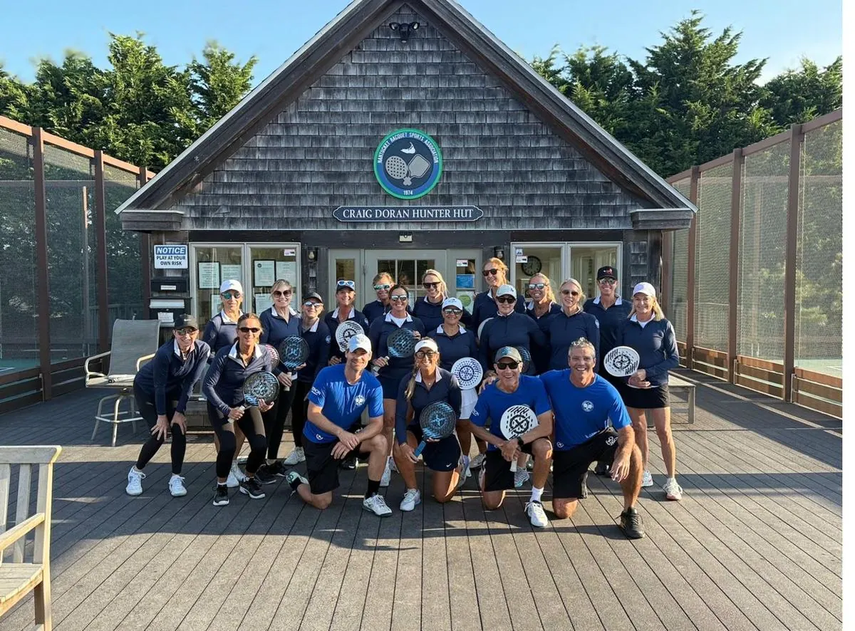 Womens session group with paddles at NRSA clubhouse